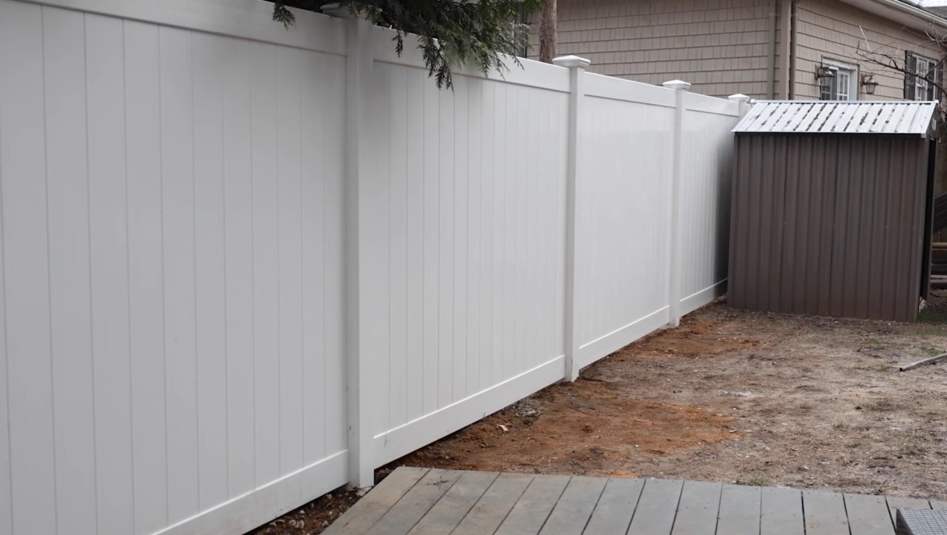 White vinyl privacy fence providing security and seclusion in Santa Cruz backyard